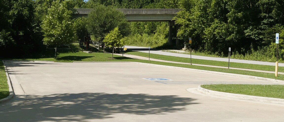 Parking area at Cub Circle in Bentonville, Arkansas - small, paved