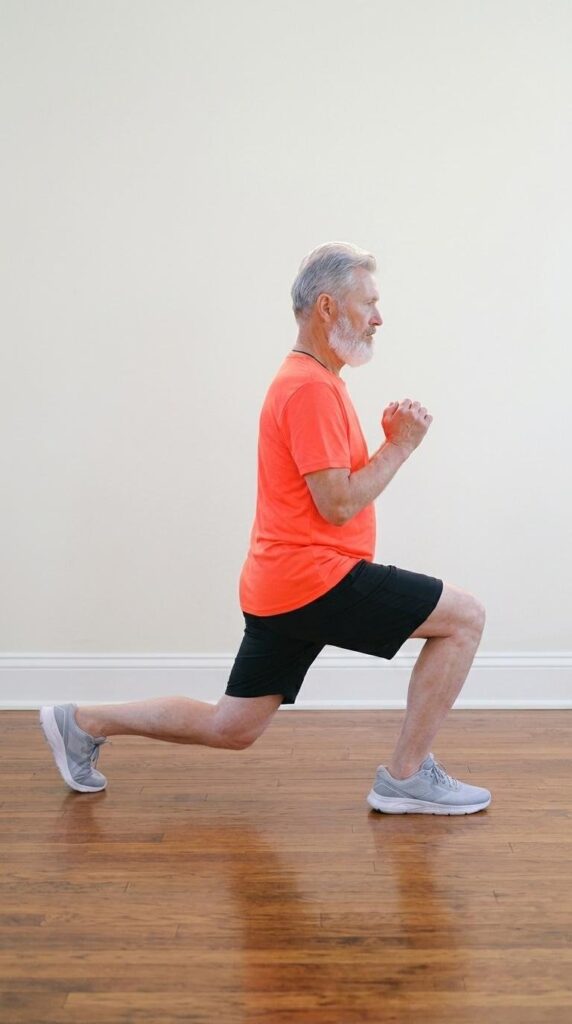 A man in a lunge with both knees bent