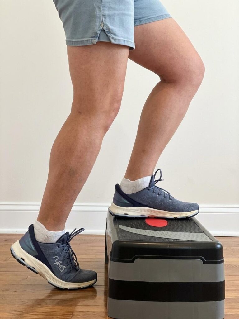 A person stepping up onto an exercise step